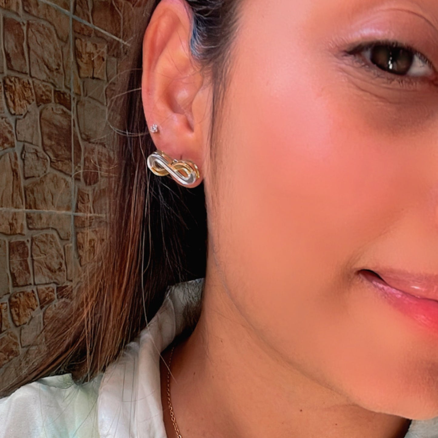 Infinity Studs - Glossy Golden and Silver - Nian by Nidhi - worn by a woman
