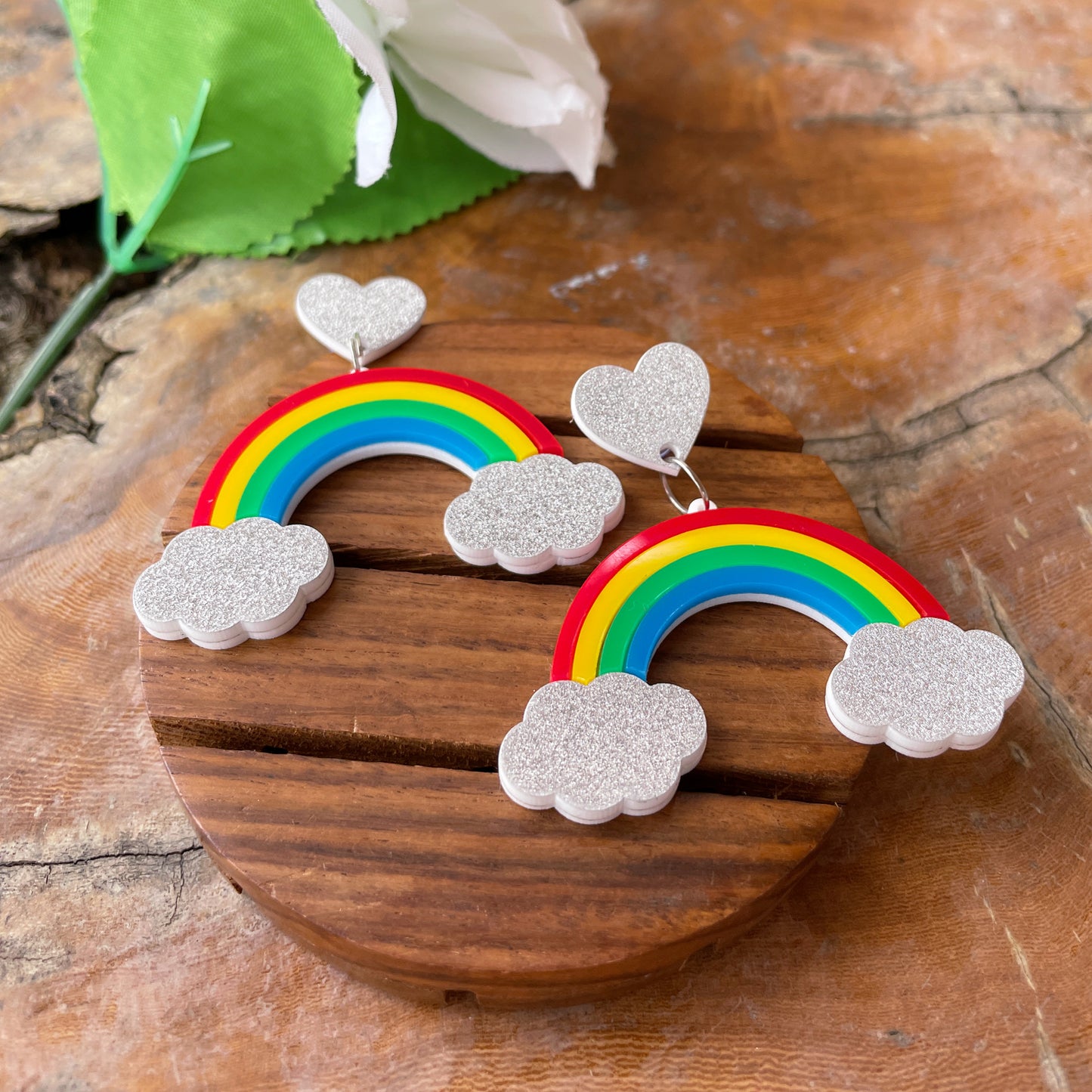 Rainbow Earrings - multi color - Red, Yellow, Green, and Blue - Silver clouds and hearts - Nian by Nidhi - in a white and brown background