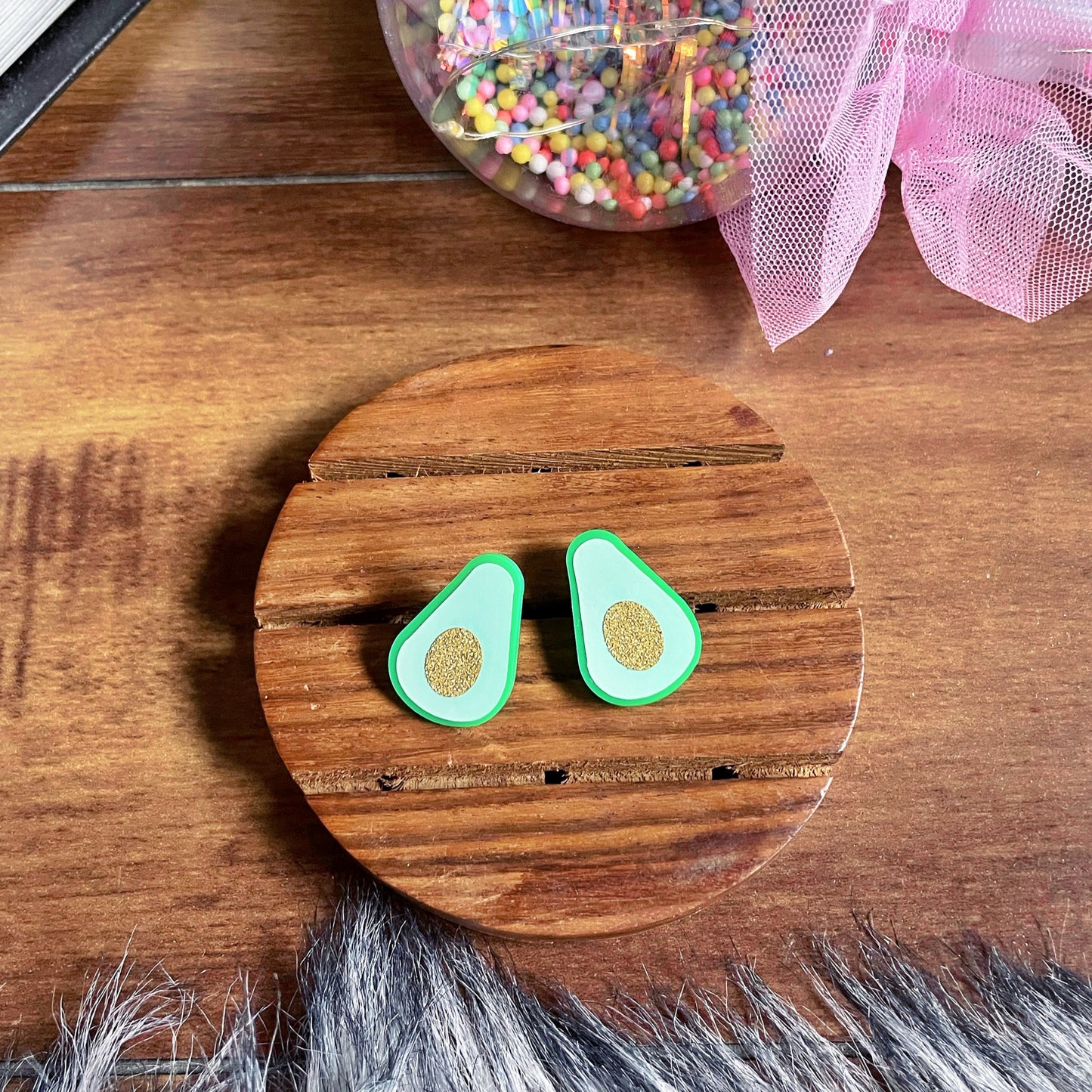Avocado Studs - Nian by Nidhi - brown and wooden background