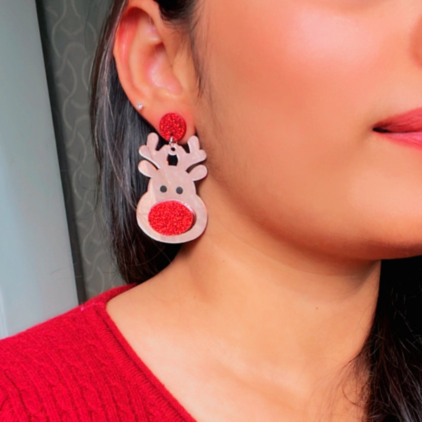 Red Rudolph Earrings - Rosegold and Red - Nian by Nidhi - worn by a woman