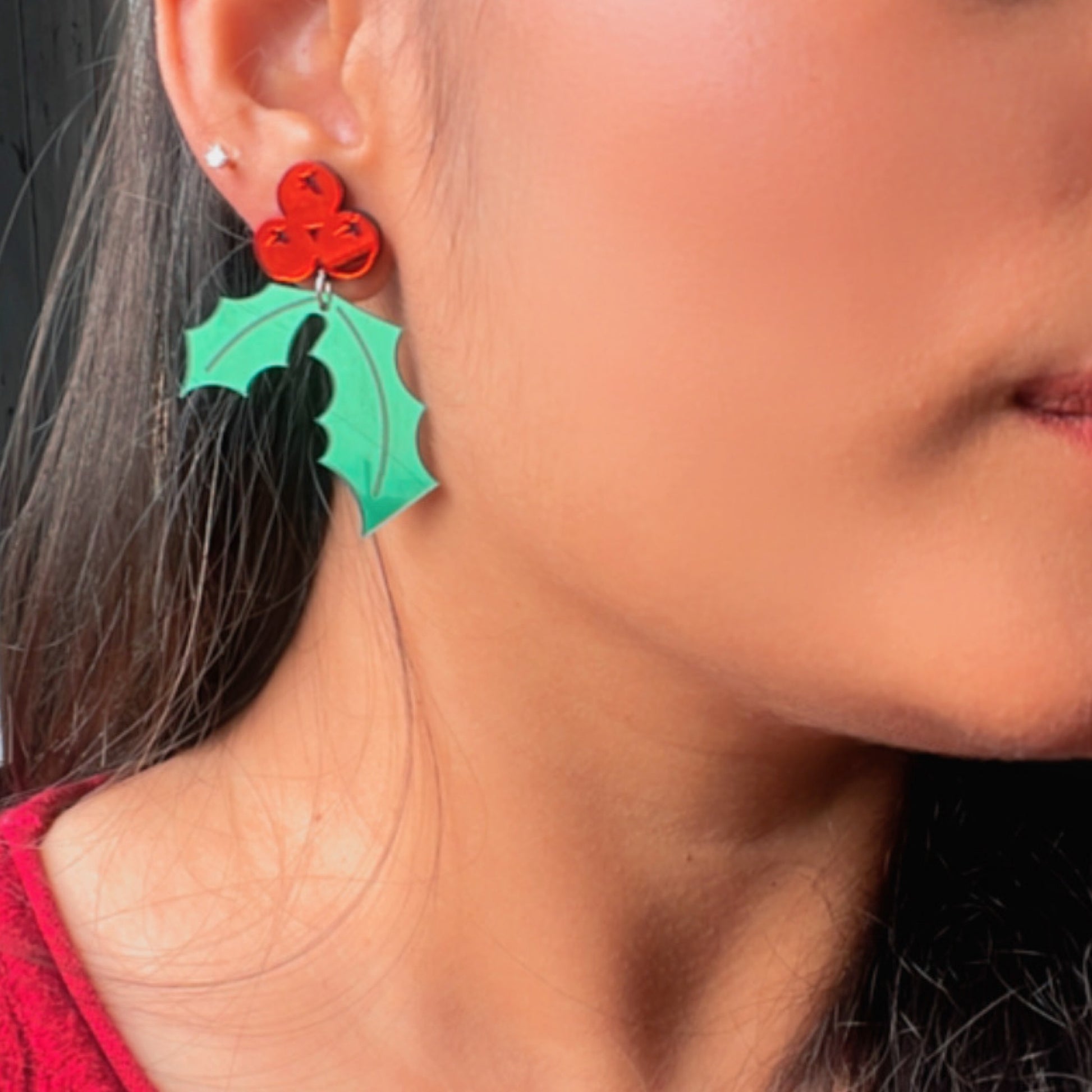 Holly Leaf Earrings - Green and Red- Nian by Nidhi- worn by a woman