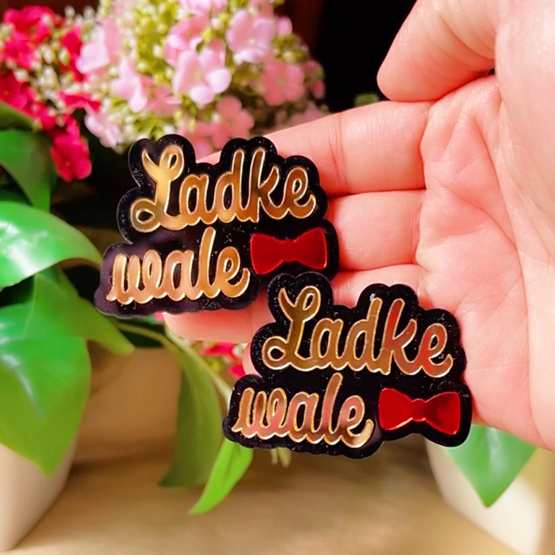 Ladke Vale Brooch Pin - Glossy Golden and Red - Nian by Nidhi - held in a hand