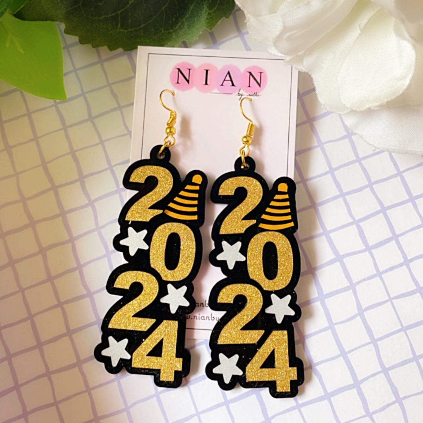 2024 Danglers - Shimmer Golden and White - Nian by Nidhi - placed in a squared-check background
