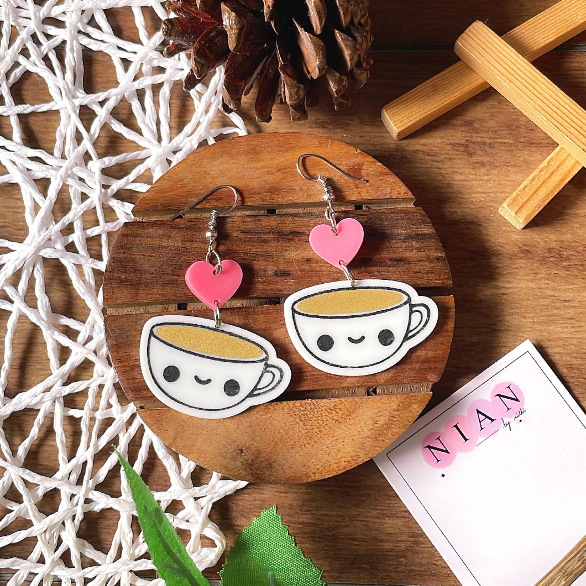 Candid Coffee Earrings - White, Pink & Brown - Nian by Nidhi - placed in a brown and white background