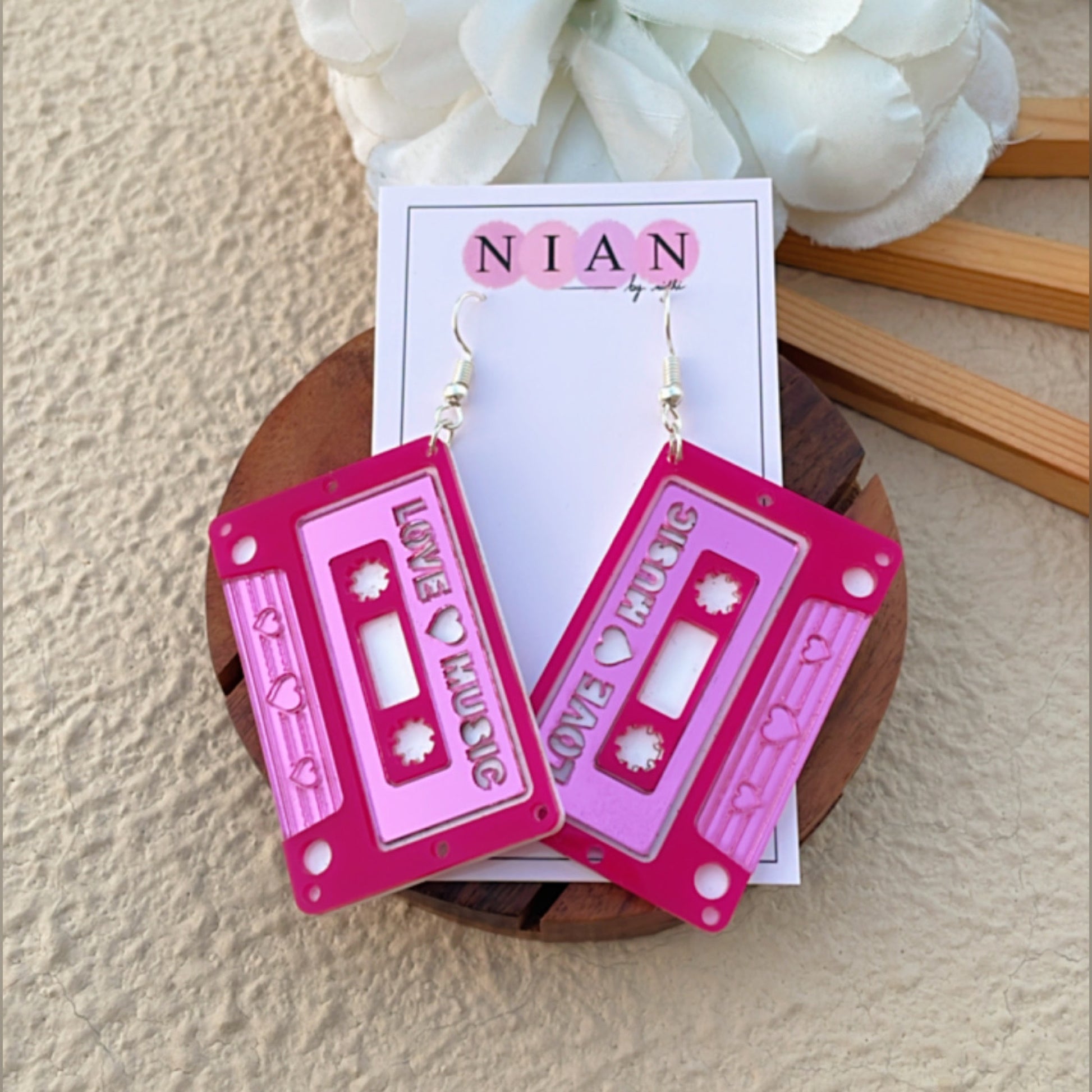 Love Cassette Earrings - Glossy Pink and White - Nian by Nidhi - placed in a brown background