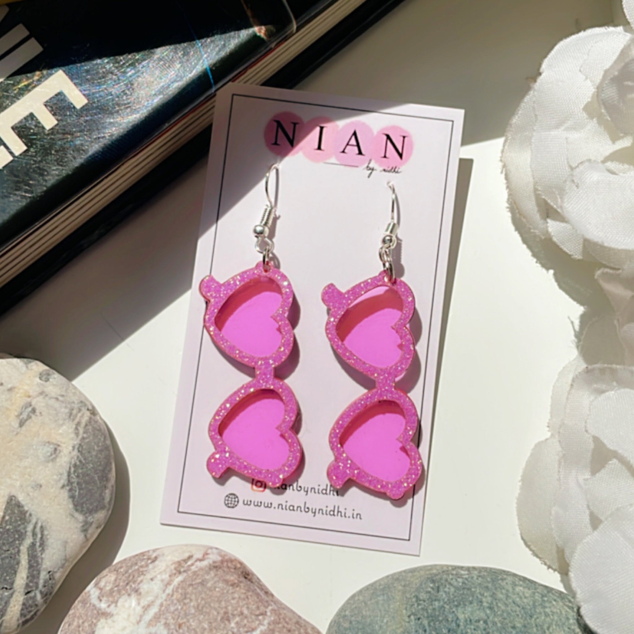 Glam Goggles Earrings - Shimmer Pink and Holographic Pink - Nian by Nidhi - placed in a white background