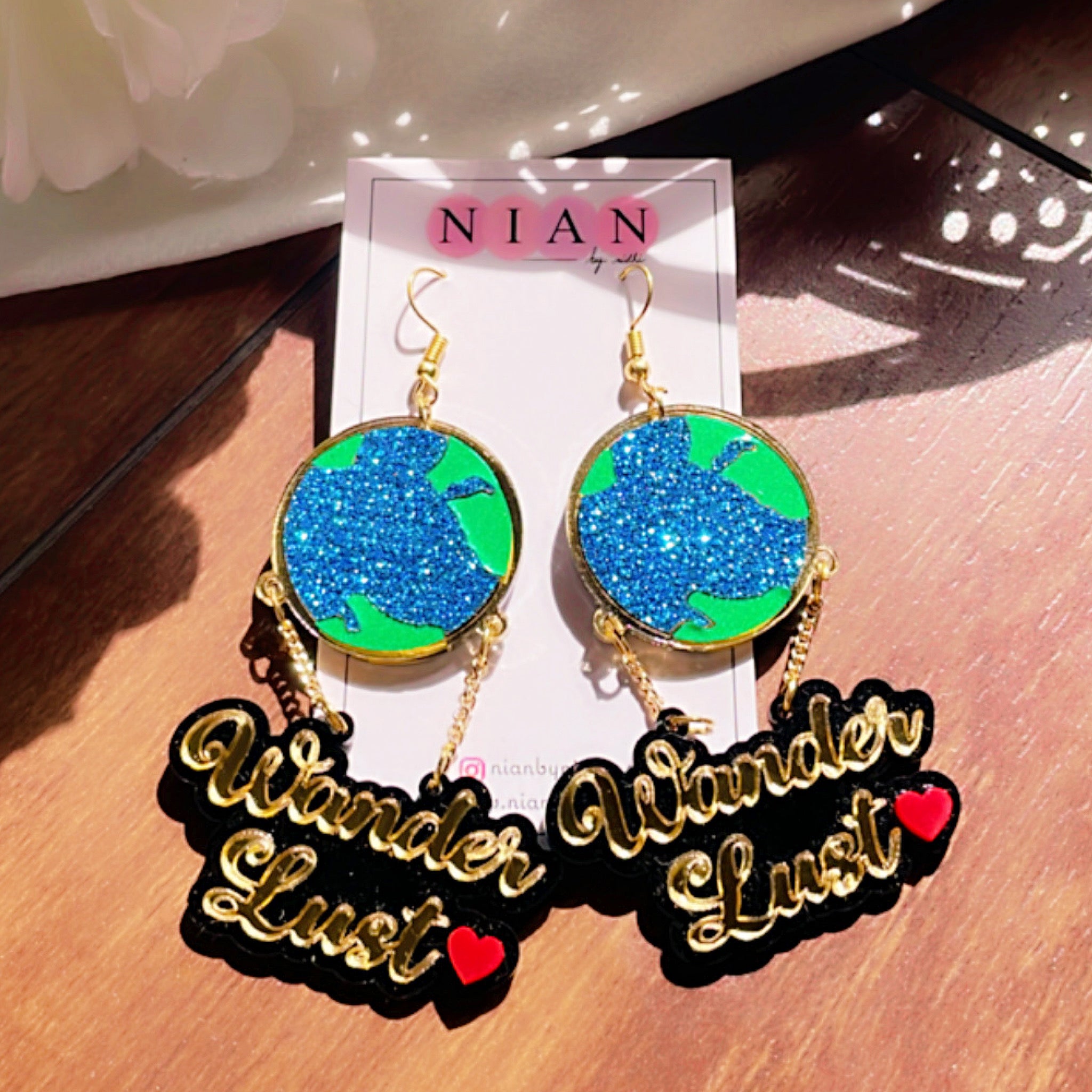 Wanderlust Earrings - Multicolor - Green, Shimmer Blue, Glossy Golden - Nian by Nidhi - placed in a brown background
