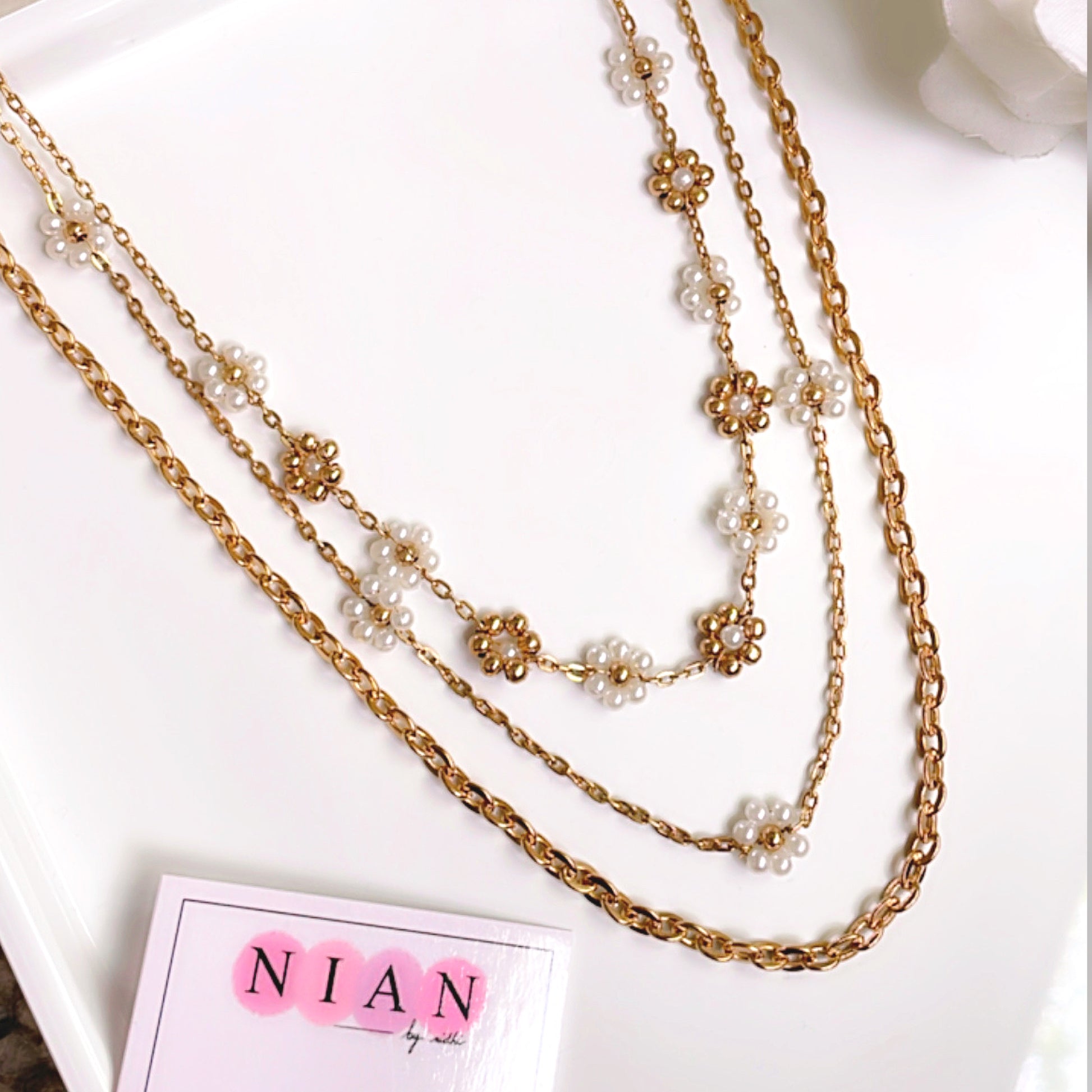 Floral Dream Layered Neckalce - Golden - Nian by Nidhi - placed in a white background
