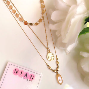 Moonburst Multi-Strand Necklace - Golden - Nian by Nidhi - placed in a white background