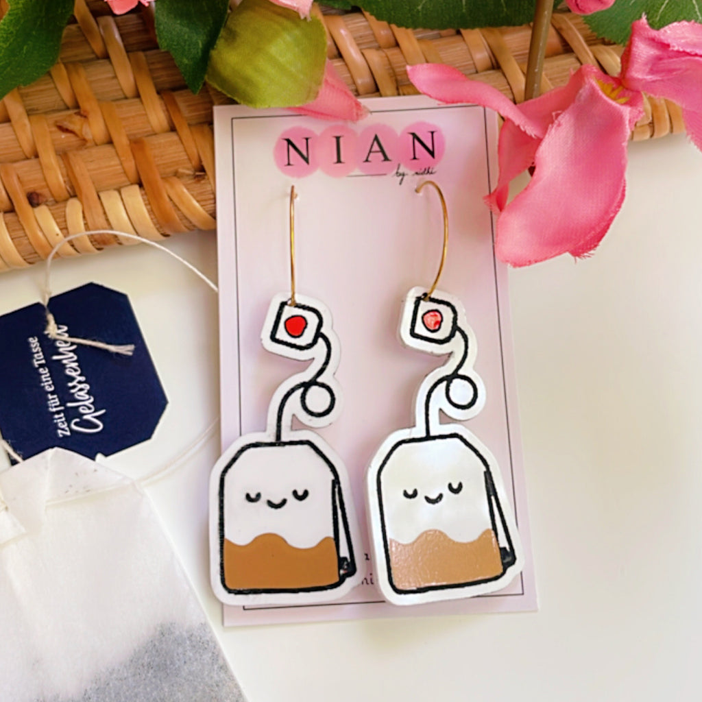 Tea Time Hoops - White, Black and Brown - Nian by Nidhi - placed in a white, pink, and brown background