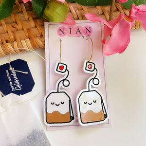 Tea Time Hoops - White, Black and Brown - Nian by Nidhi - placed in a white, pink, and brown background