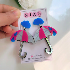 Drizzly Umbrella Earrings - Pink, White and Blue - Nian by Nidhi - placed in a white background