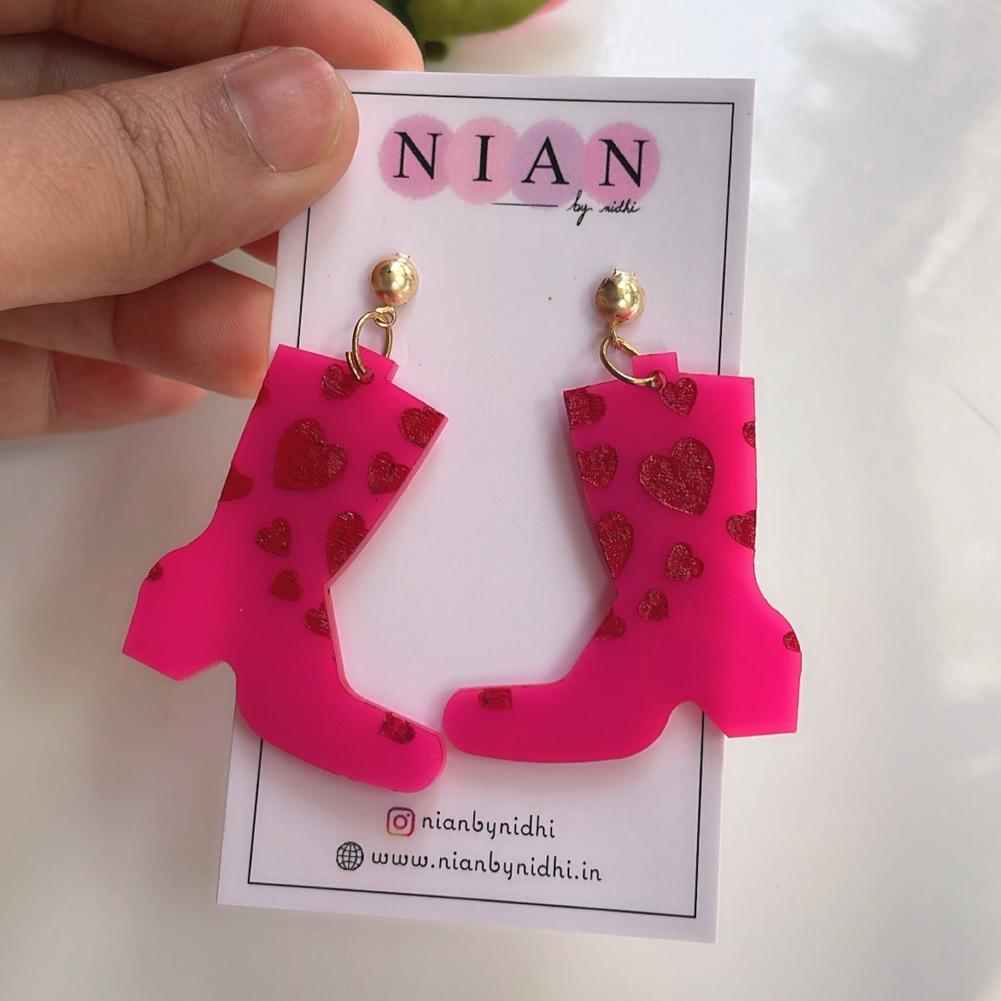 Splashy Rainboots Earrings - Pink and Red - placed in a white background