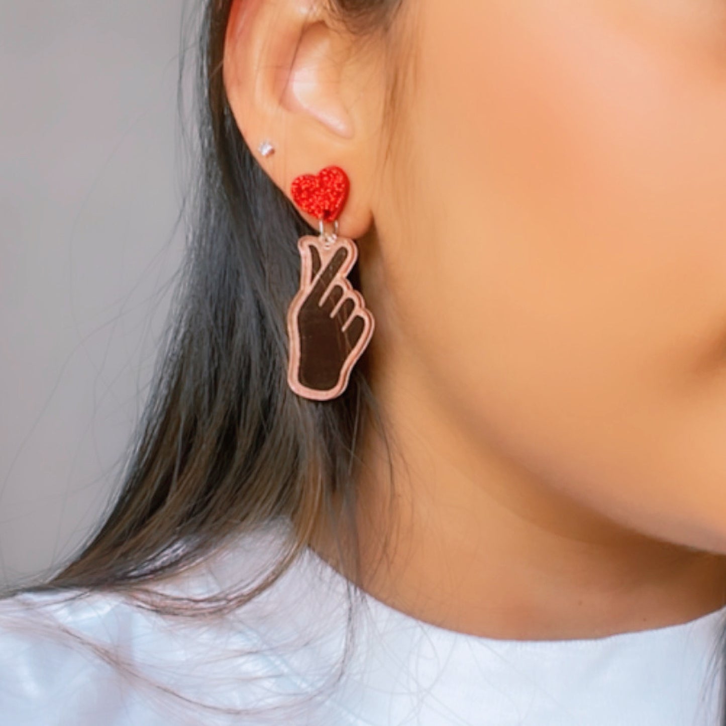 K-Pop Love Earrings - Rosegold and Red - Nian by Nidhi - worn by a woman