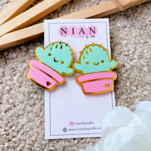 Cactus Plants Earrings - Nian by Nidhi - placed in a grey and brown background