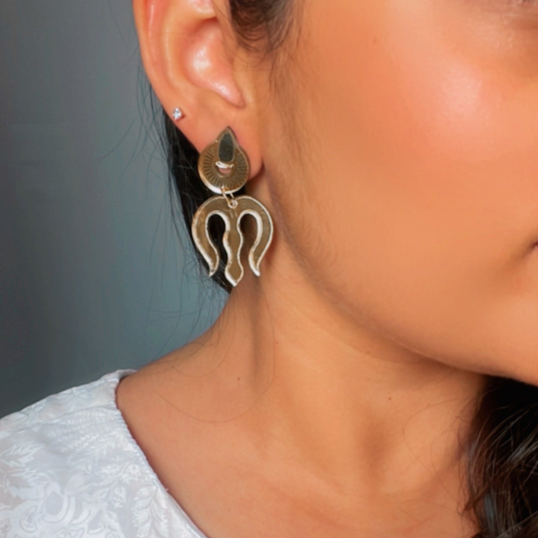 Trishul Earrings - Nian by Nidhi - Glassy Golden - worn by a girl