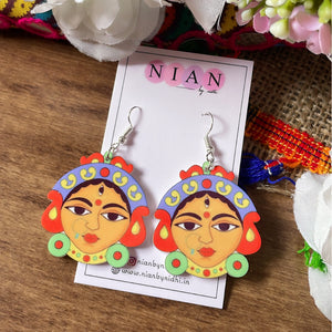 Durga Maa Earrings - Nian by Nidhi - Multicolor - placed in a colorful brown background