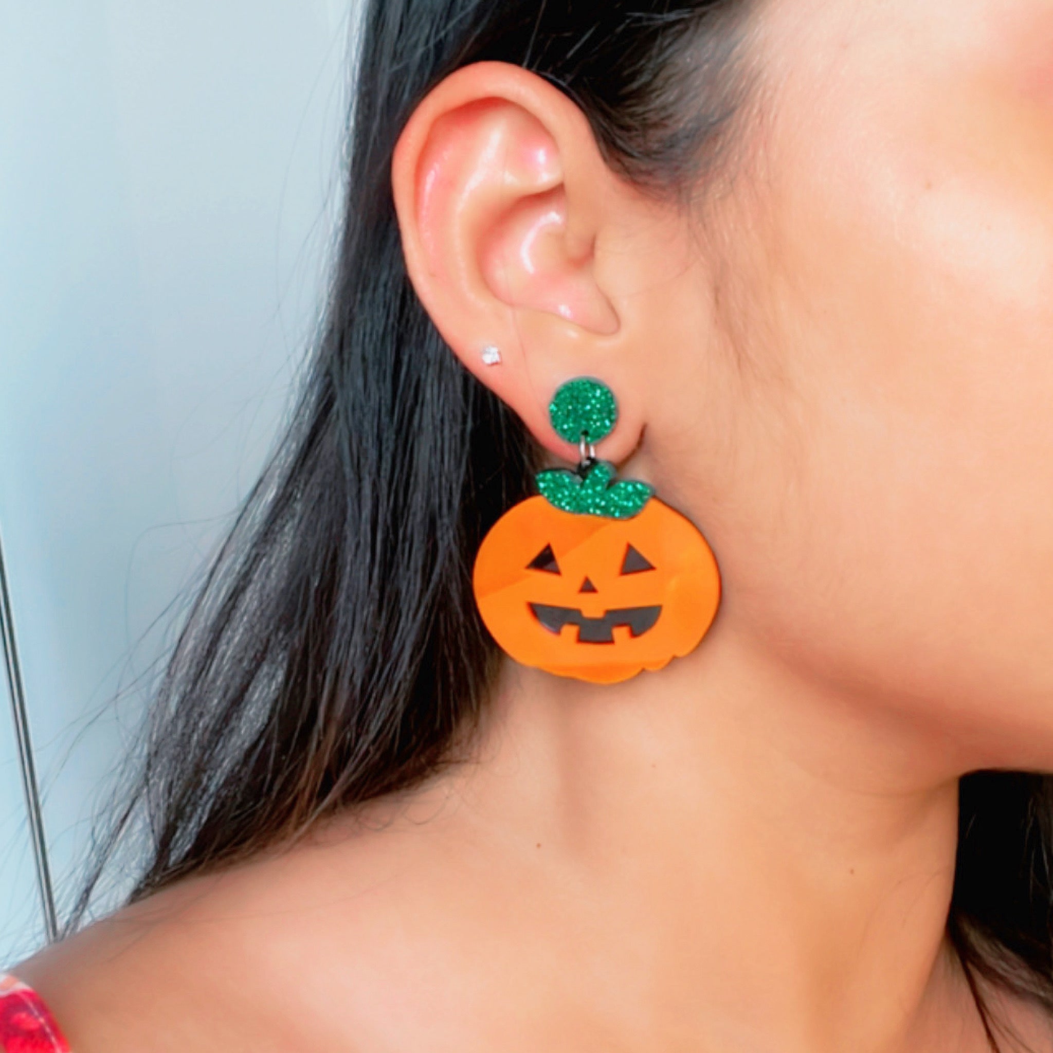 Plumpy Pumpkin Earrings - Orange, Black and Shimmer Green - Nian by Nidhi - worn by a woman