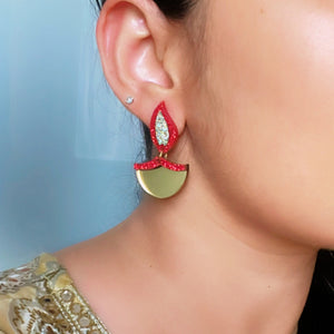 Dazzling Diya Earrings - Glossy Gold and Shimmer Red - Nian by Nidhi - worn by a woman
