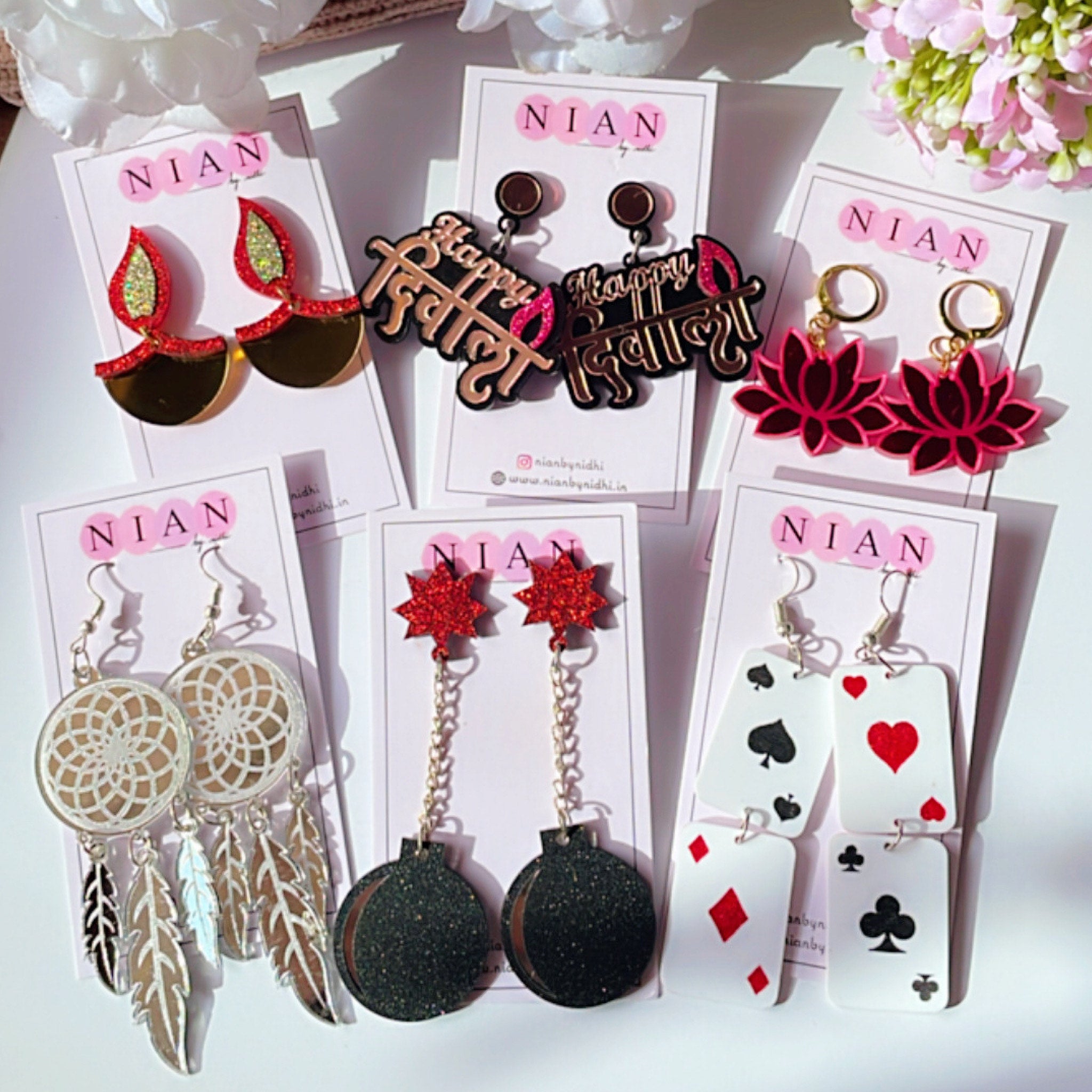 Diwali Diva Collection (Set of 6 earrings) - Nian by Nidhi - placed in a white background. Consists the following 6 earrings - Dazzling Diya, Happy Diwali, Lotus Danglers, Dreamcatcher, Pataka, Poker