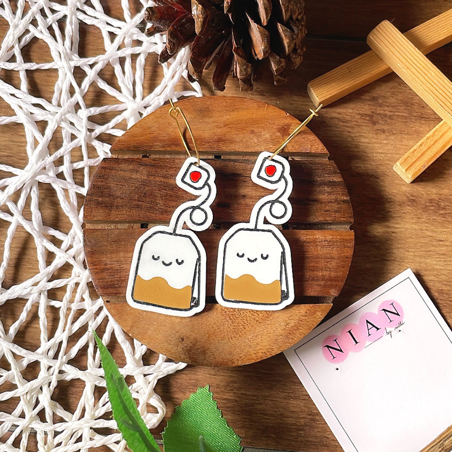 Tea Time Hoops - White, Black and Brown - Nian by Nidhi - placed in a white and brown background