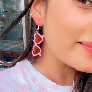 Glam Goggles Earrings - Shimmer Pink and Holographic Pink - Nian by Nidhi - worn by a woman