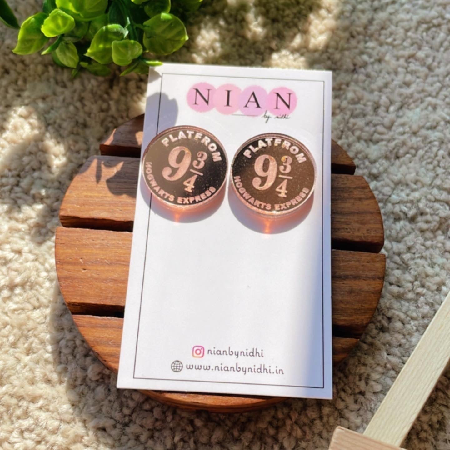 Hogwarts Express Studs - Rosegold - Nian by Nidhi - placed on a Nian by Nidhi Earring card - in a light beige background