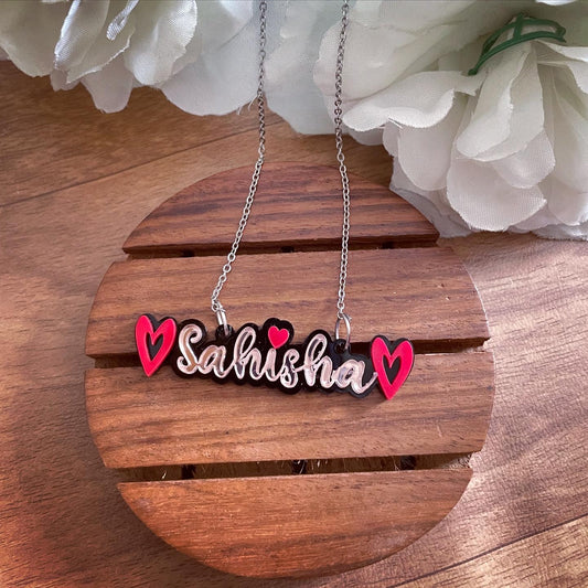 Customised Alphabet Necklace - personalised with a text -  Sahisha - red and rose gold - Nian by Nidhi - in a white and brown background