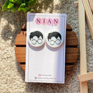 Harry Potter Face Studs - White and Black - Nian by Nidhi - placed on a Nian by Nidhi Earring card - in a light beige background