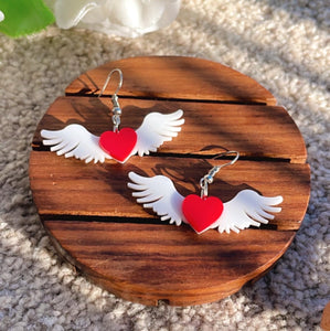 Angel of Hearts Earrings - White and Red - Nian by Nidhi - placed in a brown background