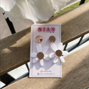 Lush Lily Earrings - White and Rosegold - Nian by Nidhi - placed in white and rusty brown background
