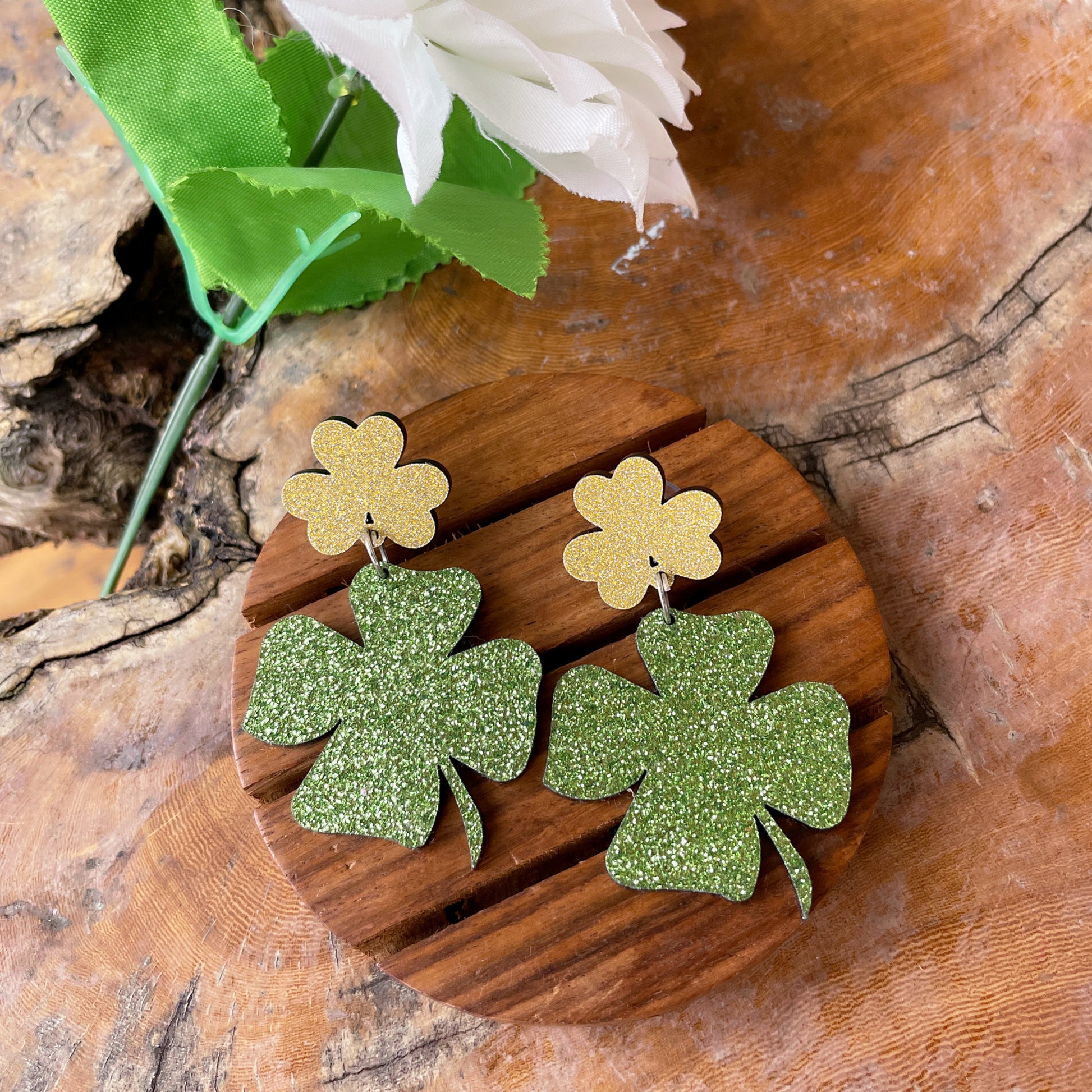 Clover Earrings - Green and Golden - Nian by Nidhi - in a white and brown background