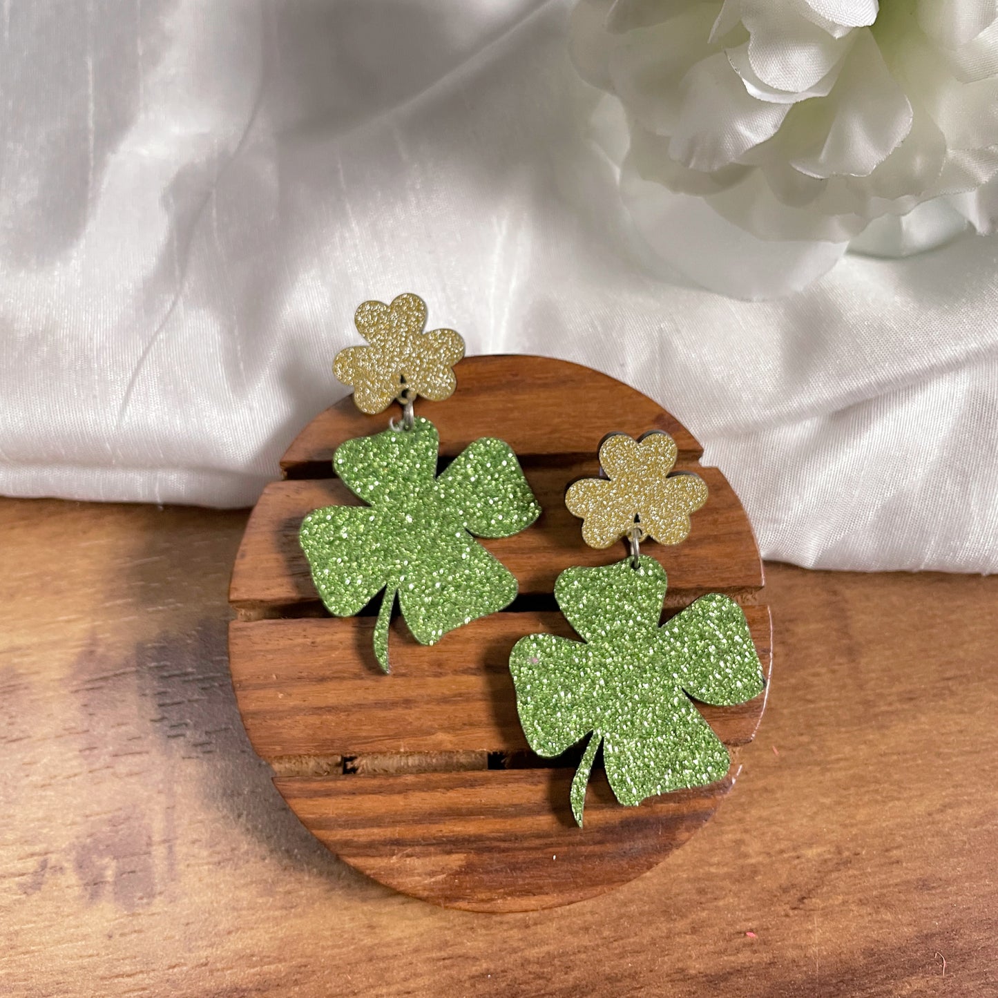 Clover Earrings - Green and Golden - Nian by Nidhi - in a white and brown background