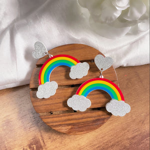 Rainbow Earrings - multi color - Red, Yellow, Green, and Blue - Silver clouds and hearts - Nian by Nidhi - in a white and brown background