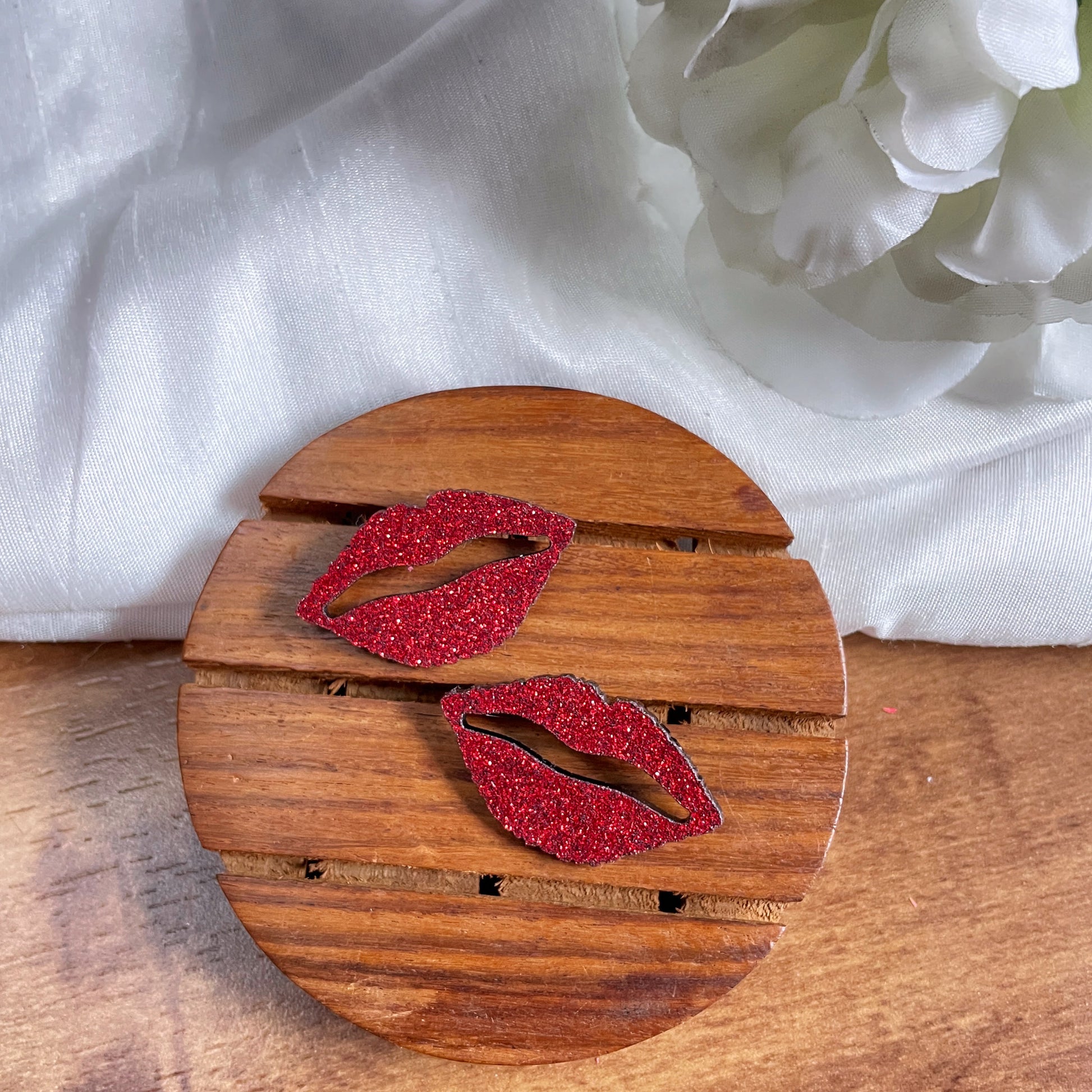 Shimmer Lips Studs - Red - Nian by Nidhi - in a white and brown background
