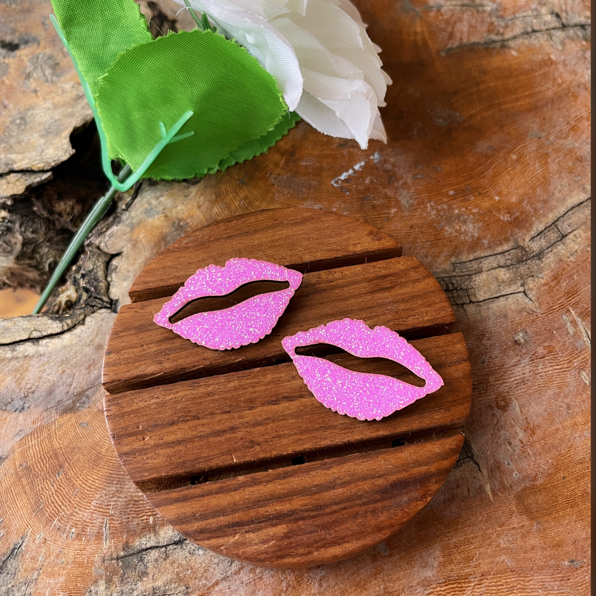 Shimmer Lips Studs - Pink - Nian by Nidhi - in a white, green, and brown background