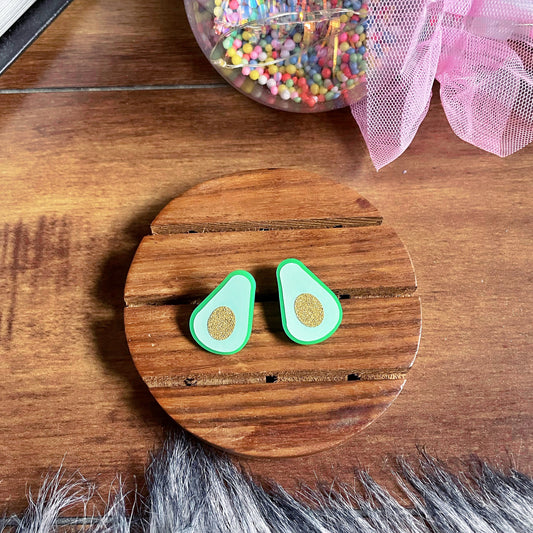 Avocado Studs - Nian by Nidhi - brown and wooden background 