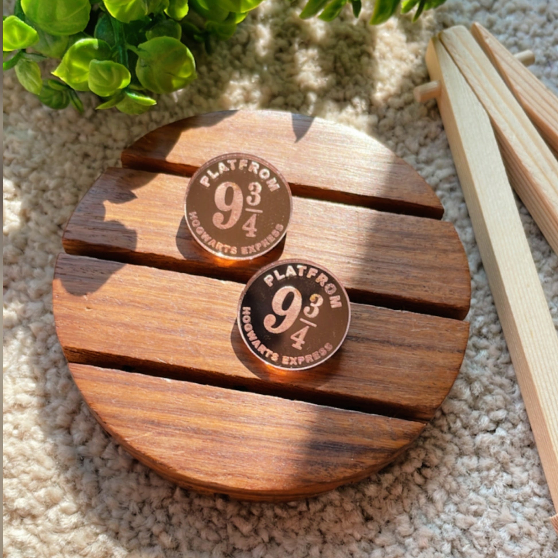 Hogwarts Express Studs - Rosegold - Nian by Nidhi - placed in a light beige background