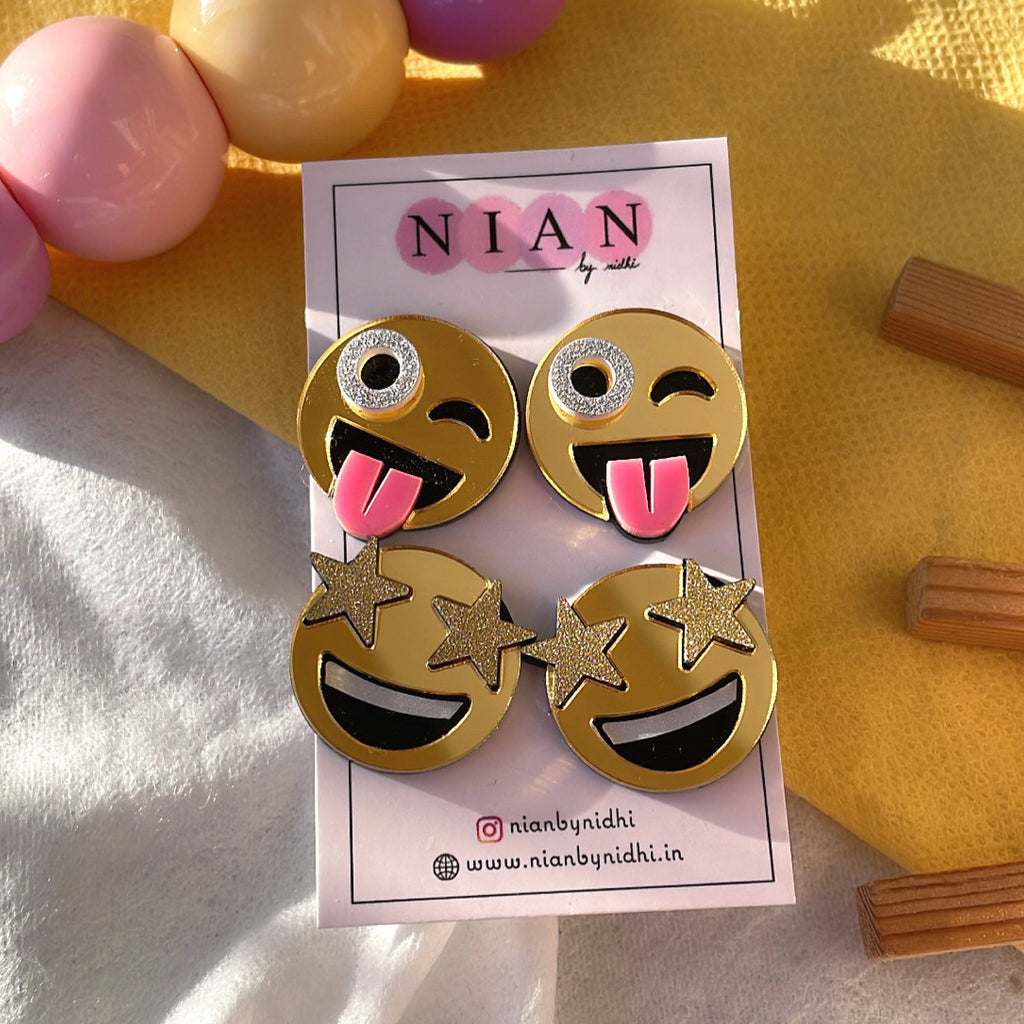 Emoji Studs Combo (Set of 2) - consists Goofy Emoji Studs and Star-Struck Emoji Studs - Golden with face detailings - Nian by Nidhi - placed in a yellow background