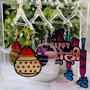 The Hanging Jewellery Organiser - Nian by Nidhi - placed with its 6 hangers and the Holi Hai! Combo that consists 4 earrings from Holi Special Collection