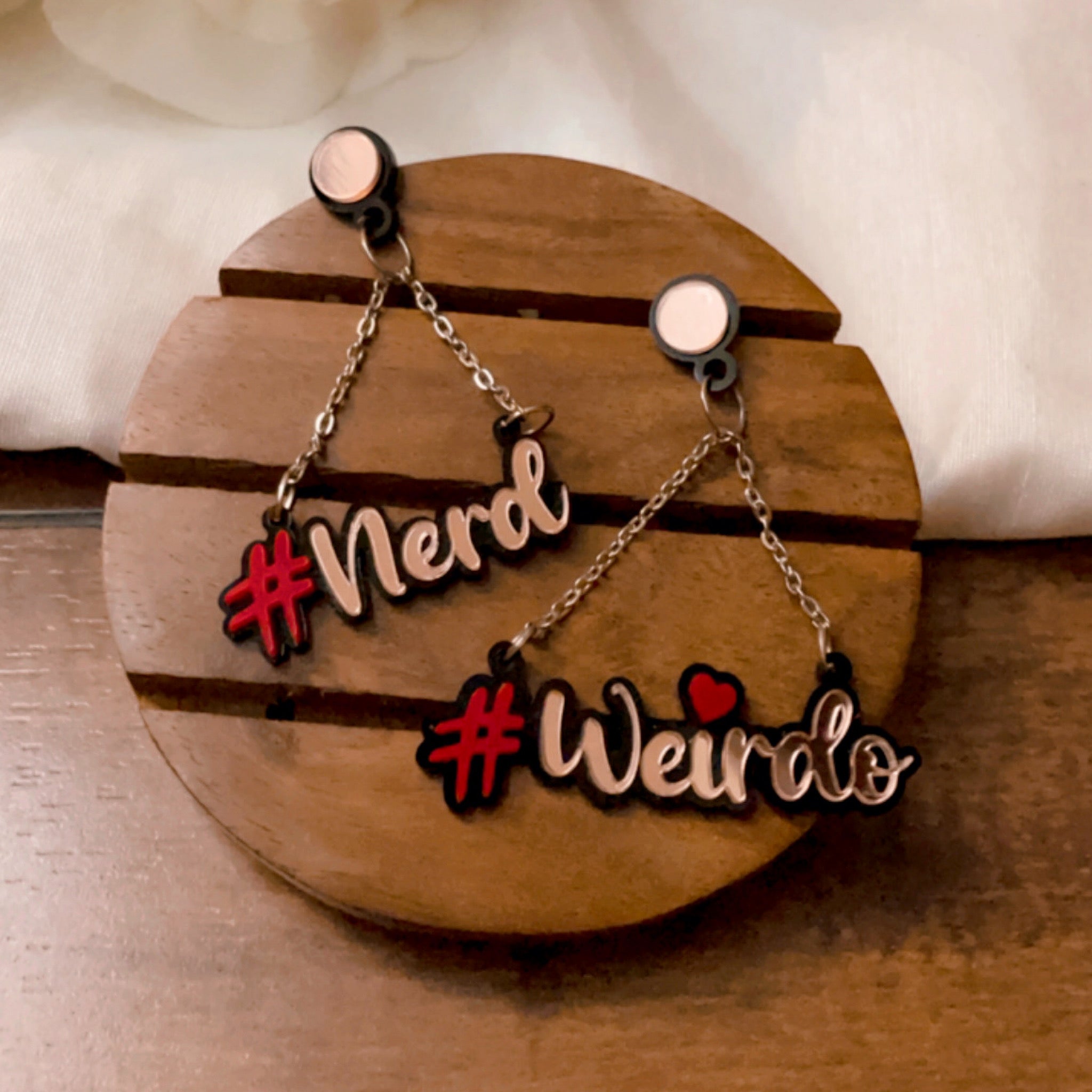 Customised Alphabet Earrings - personalised with a text - #Nerd and #Weirdo - red and rose gold - Nian by Nidhi - in a white and brown background