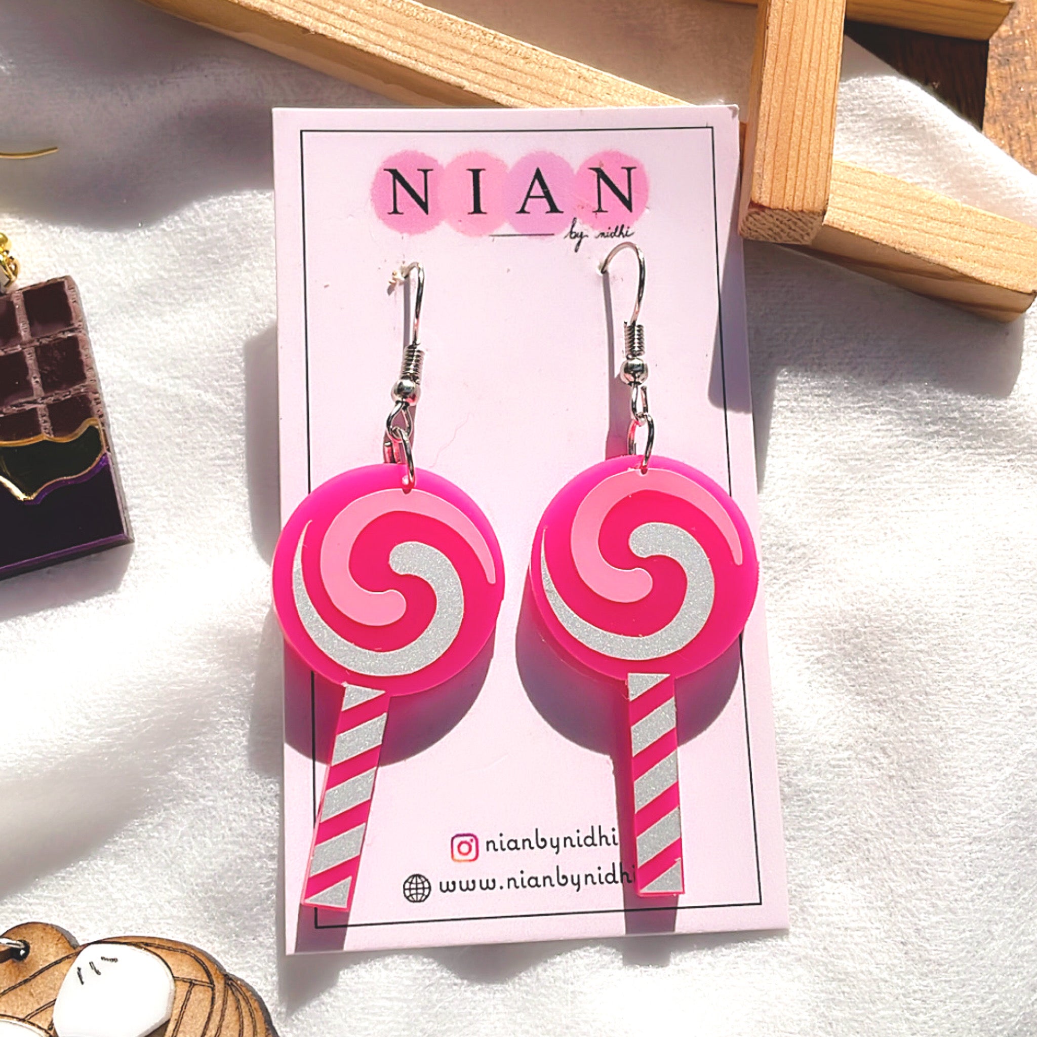 Lollipop Swirl Earrings - Pink and White - Nian by Nidhi - placed in a white background
