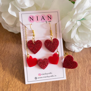 Shimmer Love Set - Red with shimmer - Nian by Nidhi - in a brown and white background, placed on Nian by Nidhi earring card