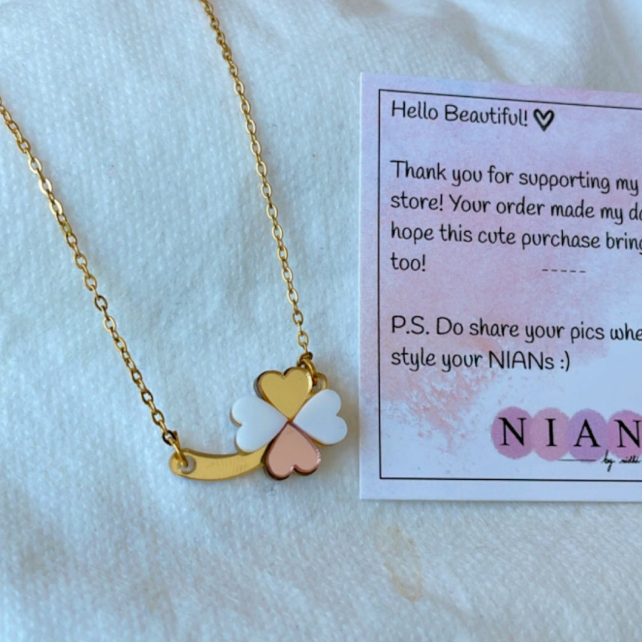 Clover Necklace - White, Rosegold, and Golden - Nian by Nidhi - placed on a Nian by Nidhi product card, in a white background