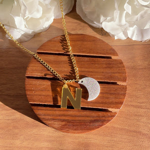 Customised Initial Necklace - with "N" and a Moon, Golden and Shimmer silver, Nian by Nidhi - in a white and brown background
