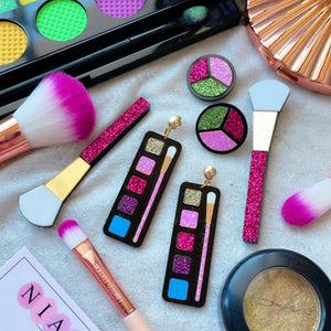 Makeup Earrings (Set of 3) - Consists Makeup Palette Earrings, Makeup Brush Earrings, and Glitter Blush Earrings - Nian by Nidhi - placed along with real makeup material