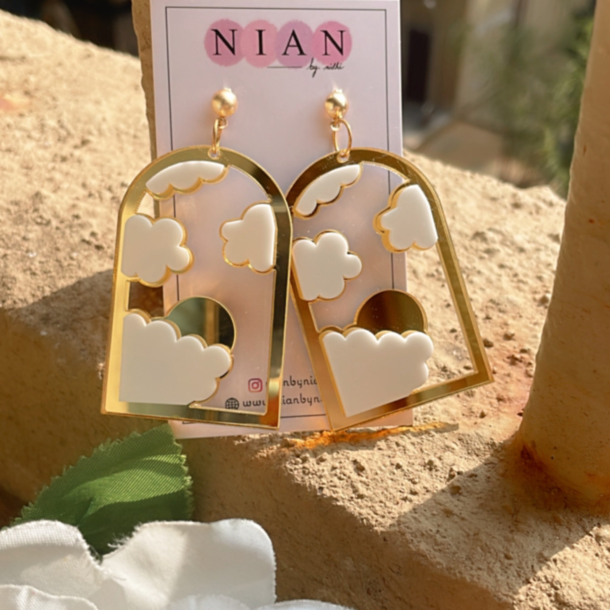 Cloudy Window Earrings - Glossy Golden and White - Nian by Nidhi - white a brown background