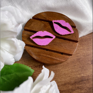 Shimmer Lips Studs - Pink - Nian by Nidhi - in a white, green, and brown background