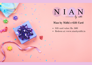 Nian by Nidhi's e-Gift Card worth Rs. 500 in a light pink background containing a box and decorating items