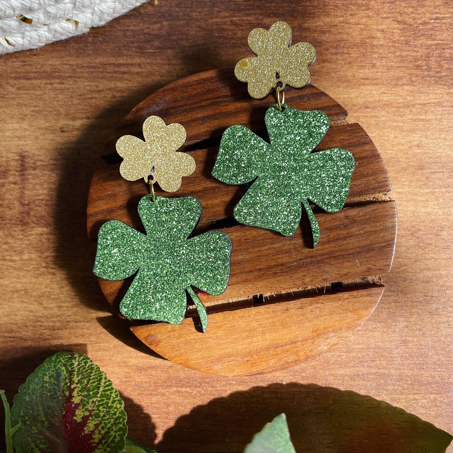 Clover Earrings - Green and Golden - Nian by Nidhi - in a white and brown background